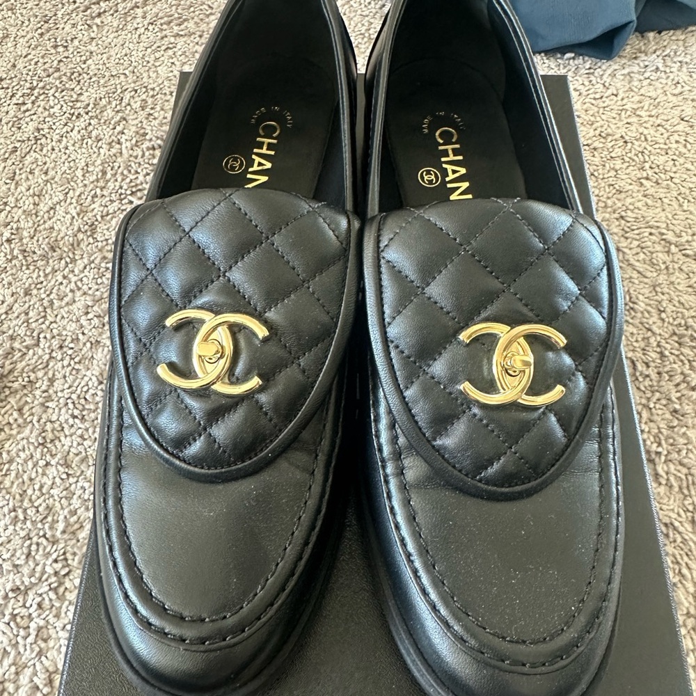 CHANEL Black Quilted Loafers with Gold Logo